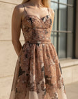 NAAMA ATHENS floral organza midi dress with sweetheart neckline, spaghetti straps, and tie-waist for special occasions.