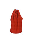 NAAMA ATHENS red sleeveless halter neck top with geometric embroidery and tie-back detail in lightweight fabric.