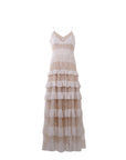 NAAMA ATHENS tiered lace maxi dress in neutral beige with V-neckline, spaghetti straps, and ruffled skirt panels.