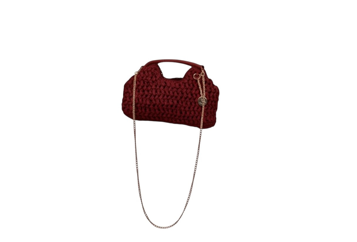 NAAMA ATHENS burgundy knitted handbag with a gold chain strap for shoulder or crossbody wear.