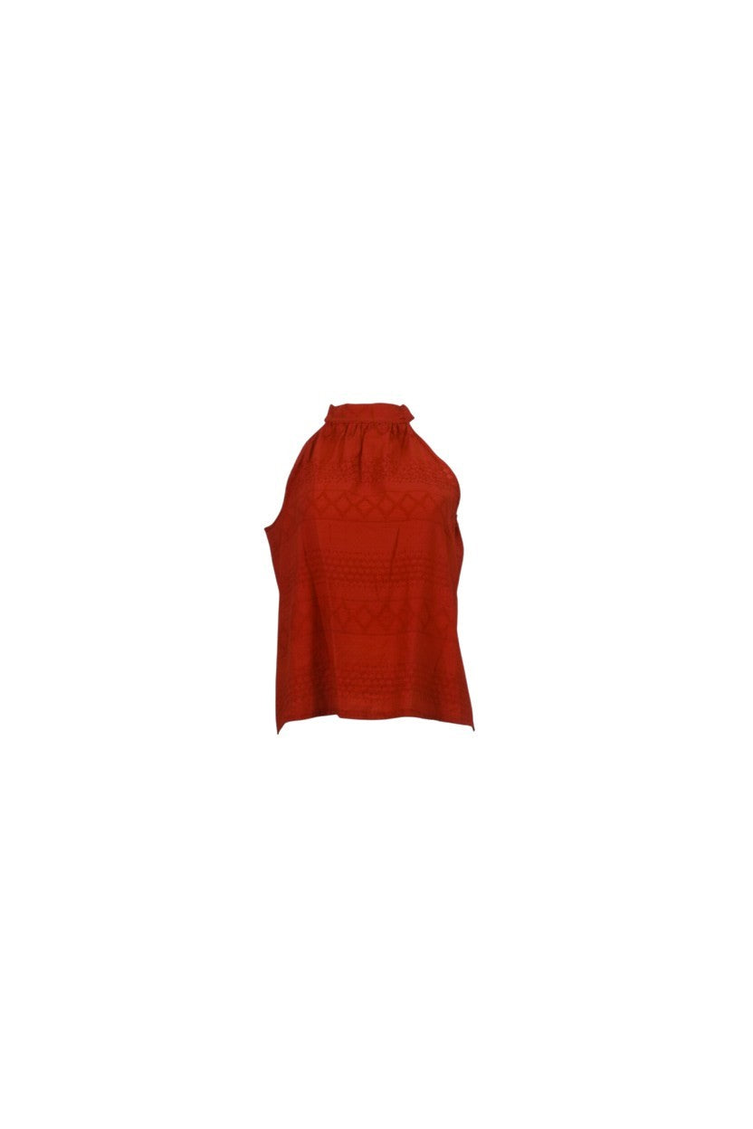 NAAMA ATHENS red sleeveless halter neck top with intricate geometric embroidery and tie-back detail.