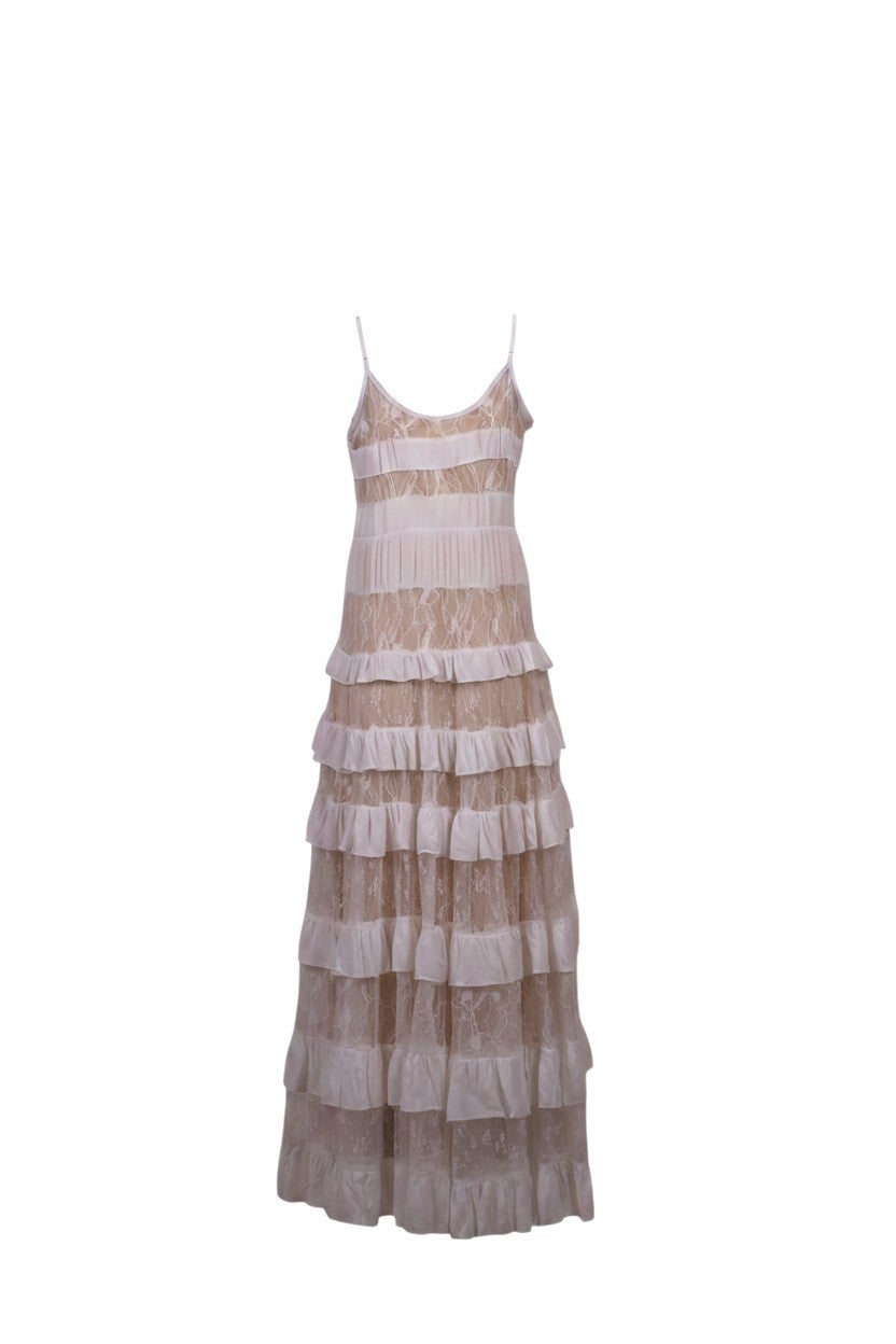 NAAMA ATHENS tiered lace maxi dress in neutral beige with spaghetti straps, V-neckline, and ruffled skirt panels.